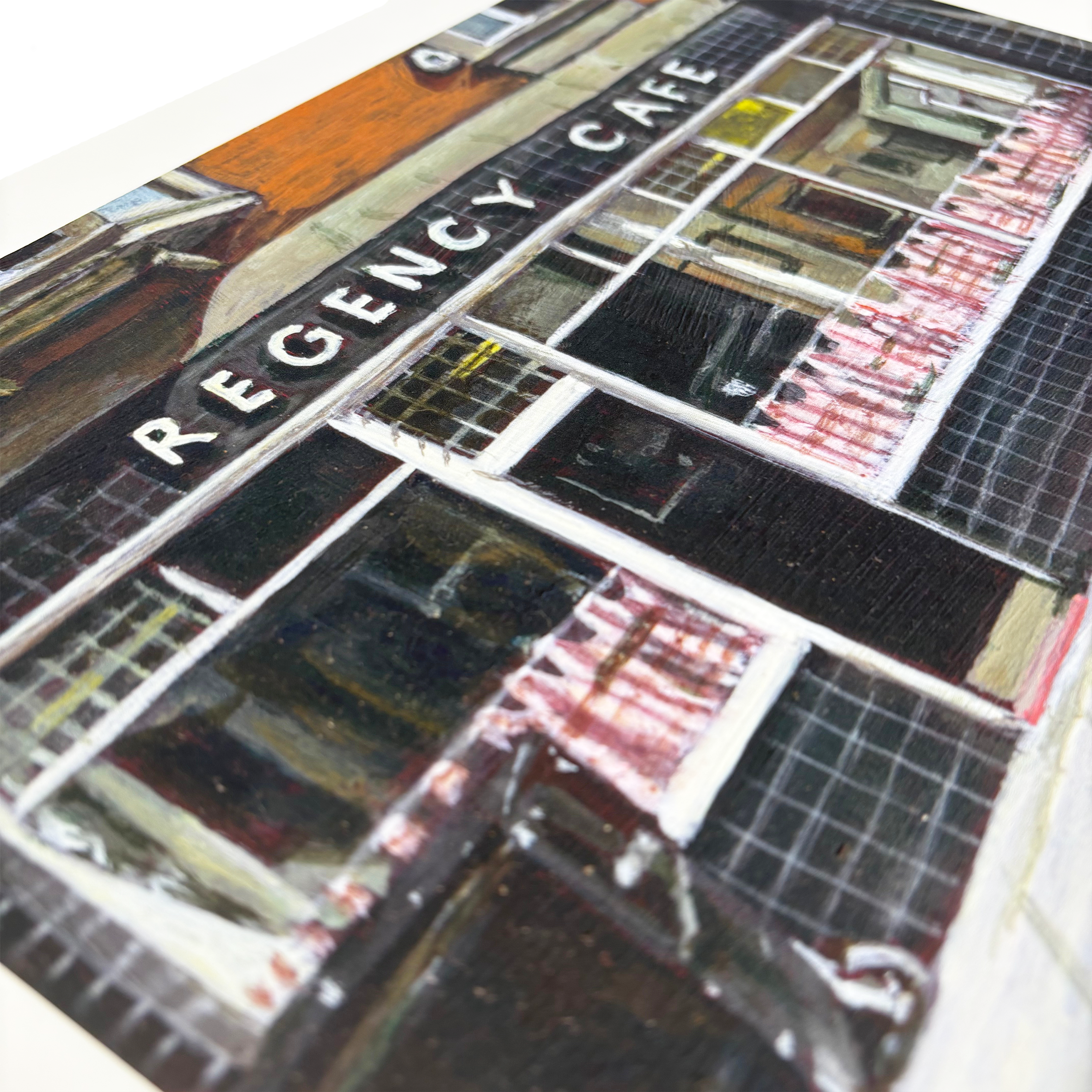 Signed limited edition print by Michelle Heron featuring Regency Cafe high street scene